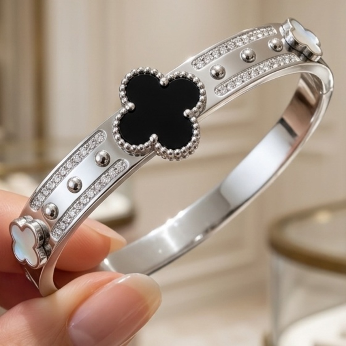 Silver Bangle With Clover Design Black And White