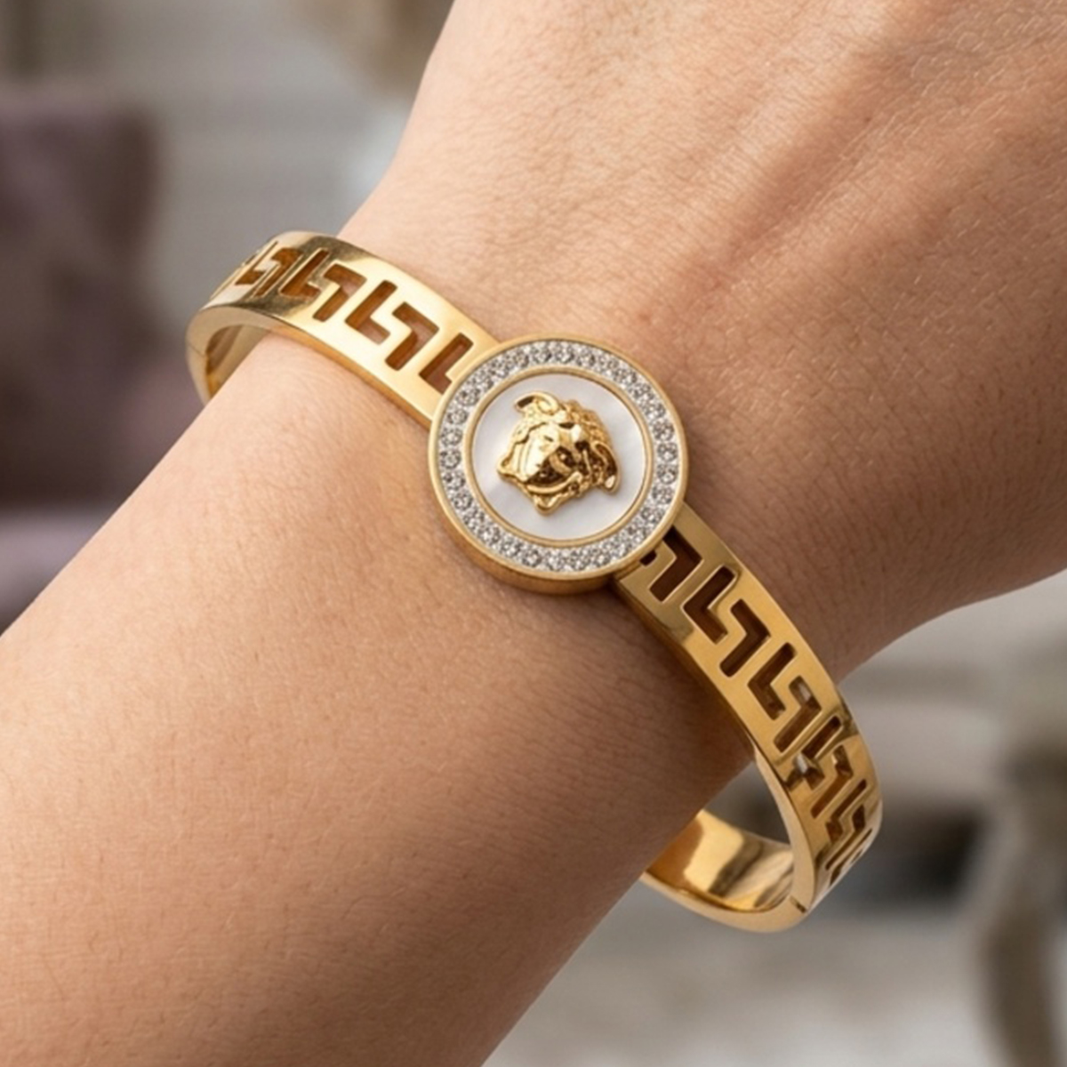 Golden Bangle With Medusa Head Design
